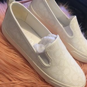 White calvin klein slip ons